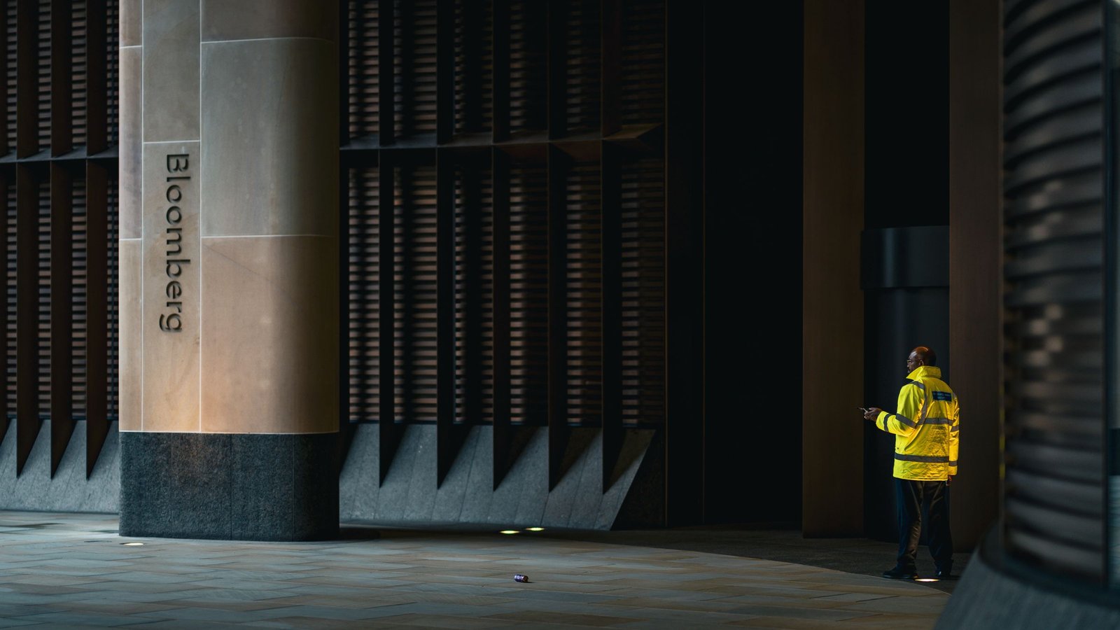 Uniformed security guard on duty at a corporate building entrance